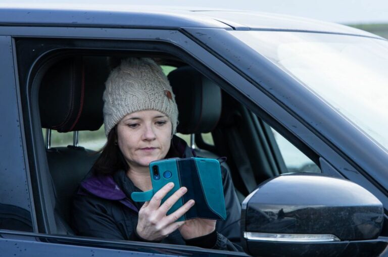 Search Never Sleeps Lady in Car on Phone news story