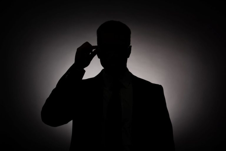 Dark silhouette of businessman